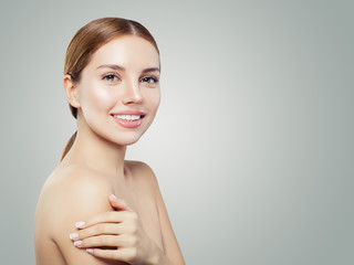 Young woman face. Smiling girl with healthy skin portrait