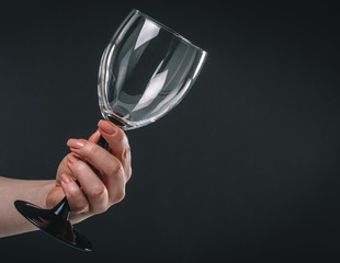 empty wine glass in female hand