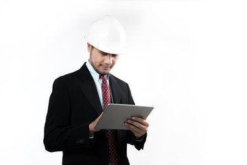Portrait of asian engineer or architect smiling and using tablet isolated on white background