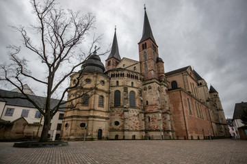 Trier / Germany - February 9 / 2019 : backside view of Saint Peter's cathedral at a cloudy day and...