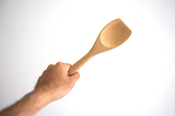 Male hand holding a jar of spice on white background