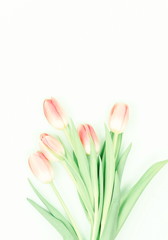 Flowers composition background. bouquet of pink tulips on a white background. top view. copy space. Holiday concept. Pastel colors background