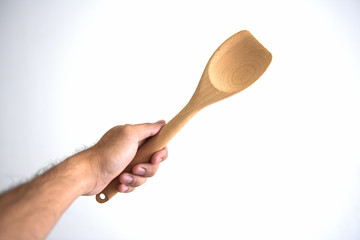 Male hand holding a jar of spice on white background