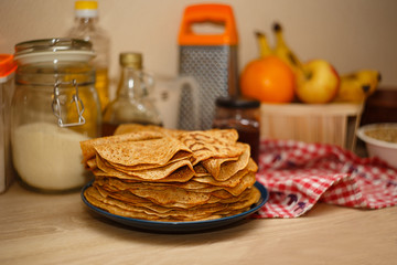a lot of ruddy pancakes on a plate