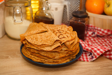 a lot of ruddy pancakes on a plate