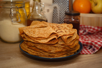 a lot of ruddy pancakes on a plate