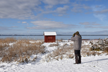 Birder by the coast in winter season