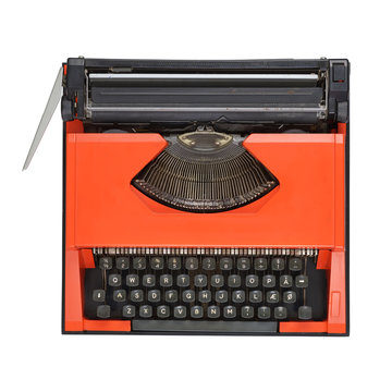 Red manual typewriter isolated