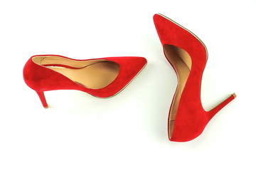 Women red high heel shoes on white background.Fashion blog look.Copy space 