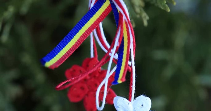 Martisor is a red and white string and which is offered by people on March 1 as love talisman. Moldavian and Romanian spring symbol &ndash; Martisor. Traditional holyday accessory celebrating the beginning 