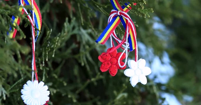 Moldavian and Romanian spring symbol &ndash; Martisor. Martisor is a red and white string and which is offered by people on March 1 as talisman. Traditional holyday accessory celebrating the spring
