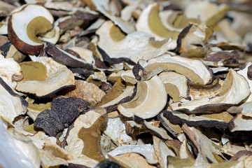 Sliced and dried boletus mushrooms. Dry wild mushrooms as background