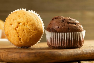 Chocolate cake and nut cake, homemade cakes on wooden background