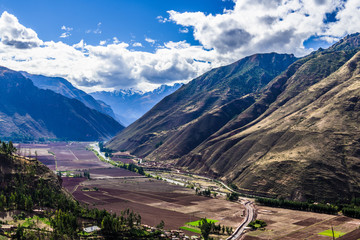 Naklejka premium The road passes through the mountain valley in the Andes