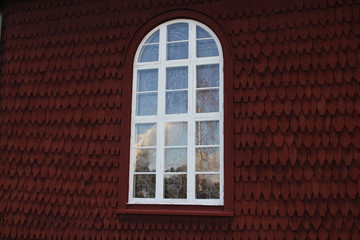 A window on a red wall