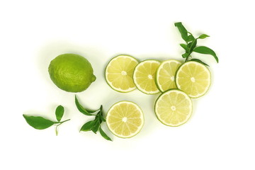 sliced lime vith leaves isolated on white background .Top view. Flat lay 