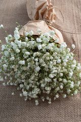 Beautiful bouquet, white flowers on a natural background, rustic style.