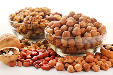 Different nuts in glass cups