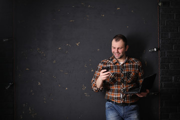 Male architect builder in a protective helmet