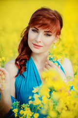 beautiful girl in blue dress with yellow flowers