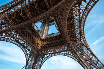 Wide shot of Eiffel Tower with blue sky in Paris