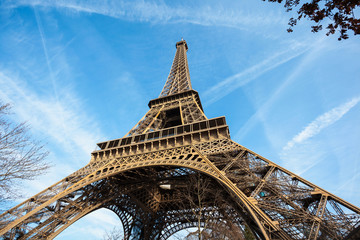 Wide shot of Eiffel Tower with blue sky in Paris