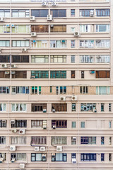 Fototapeta na wymiar facade of an apartment house downtown Kowloon with small rooms