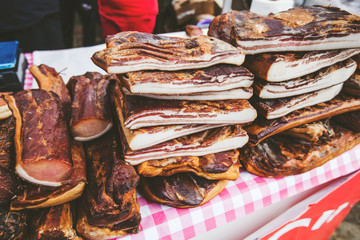 Domestic Traditional Food Smoked Bacon At Local Farmers Marketplace