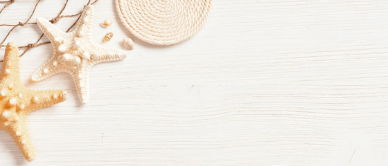 White textured wooden surface decorated with sea shells