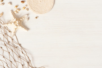 White textured wooden surface decorated with sea shells