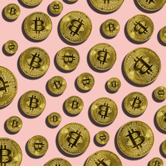 Bitcoin coins with shape on pink background. Bitcoin mining concept