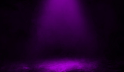 Abstract purple spotlight with mist fog on background. Smoke stage studio