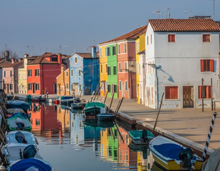 Fototapeta na wymiar Burano, an island in the Venetian Lagoon, Venice, Veneto, northern Italy. Located at the northern end of the Lagoon, known for its lace work and brightly coloured homes.