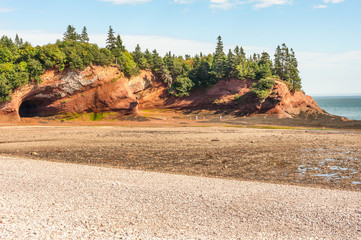 Famous sandstone sea caves near St Martins village at low tide, New Brunswick, Canada