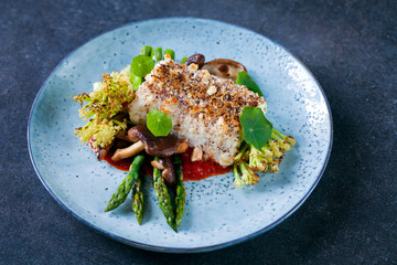 Halibut with hazelnut crust with roast red pepper sauce, asparagus, cauliflower and shiitake...