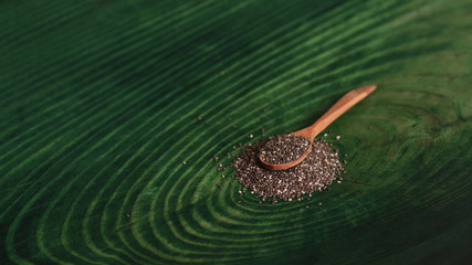 Healthy food Chia seeds in a wooden spoon. Organic vegetarian food closeup.