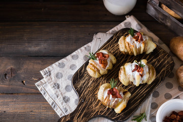 Baked potato with bacon and fresh yogurt