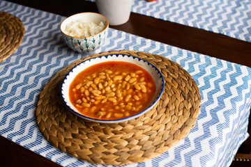 kurufasulye aka baked white beans, traditional turkish food with pilaf