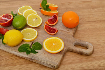 Mix citrus fresh fruit on the wooden table