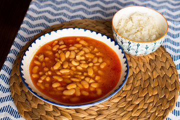 kurufasulye aka baked white beans, traditional turkish food with pilaf