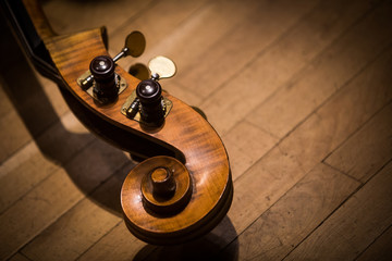 Double bass scroll and tuning pegs