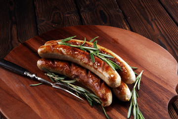 Grilled sausages with spices on a wooden table - Home-made Pork Sausages