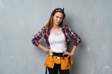Craftsmen or electrician woman laughing looking to the front