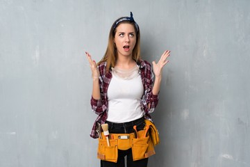 Craftsmen or electrician woman frustrated by a bad situation