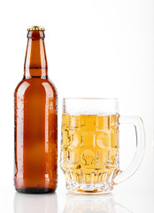 Mug and bottle of beer with green hops, wheat ears and grains on white background. Unfiltered beer. Alcoholic beverages. Hop.