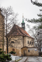 Fototapeta na wymiar A small old stone chapel in Prague's highest city