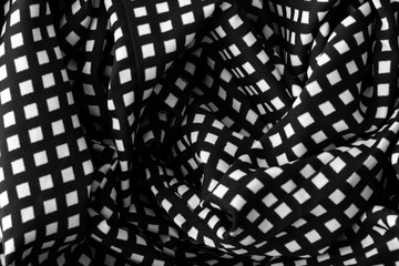 Fragment of black and white fabric. Plaid cotton fabric background
