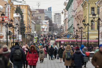 crowd of people walking on street