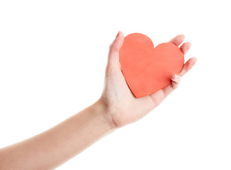 Obraz premium Female hand isolated on white background. White woman's hand showing symbols and gestures. Red wooden heart in hand. Love