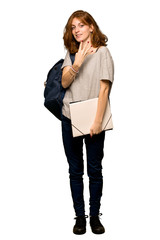 A full-length shot of a Young redhead student happy and counting four with fingers over isolated white background